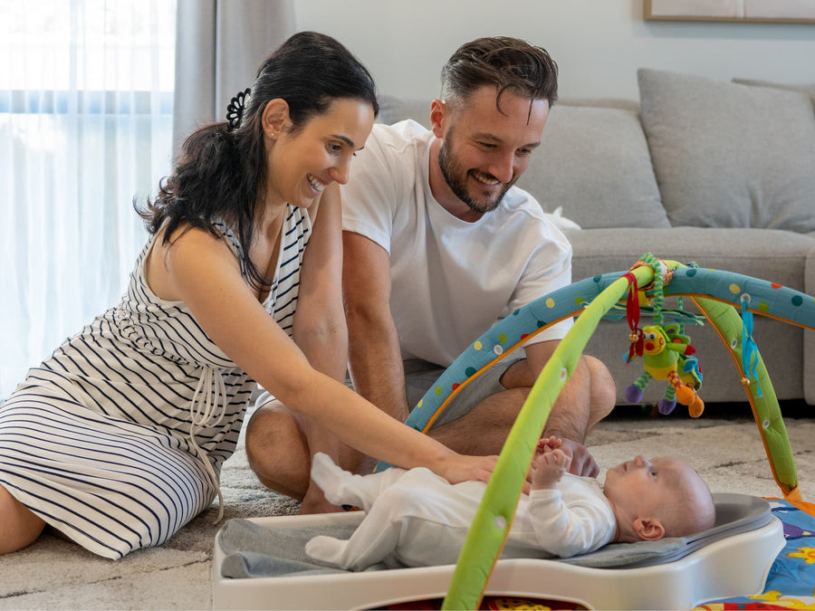 Joel and Vanessa with a baby on the Perfect Noggin