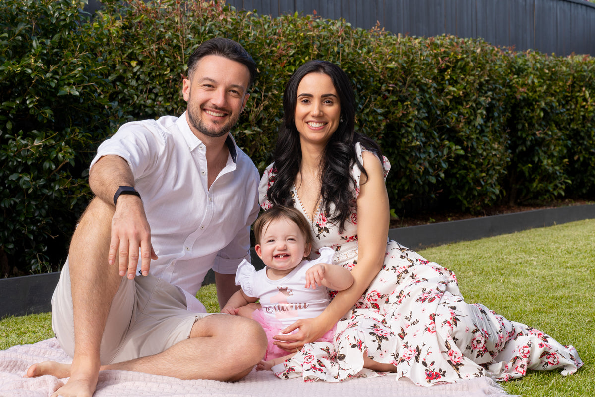 The dedicated owners of The Perfect Noggin Australia pictured with their child, showcasing the family-led commitment to providing infant cranial health solutions across the country.