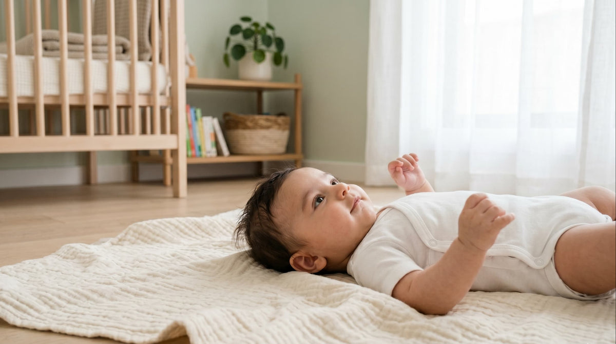 A baby lying on their back on a rug in a nursery, looking up